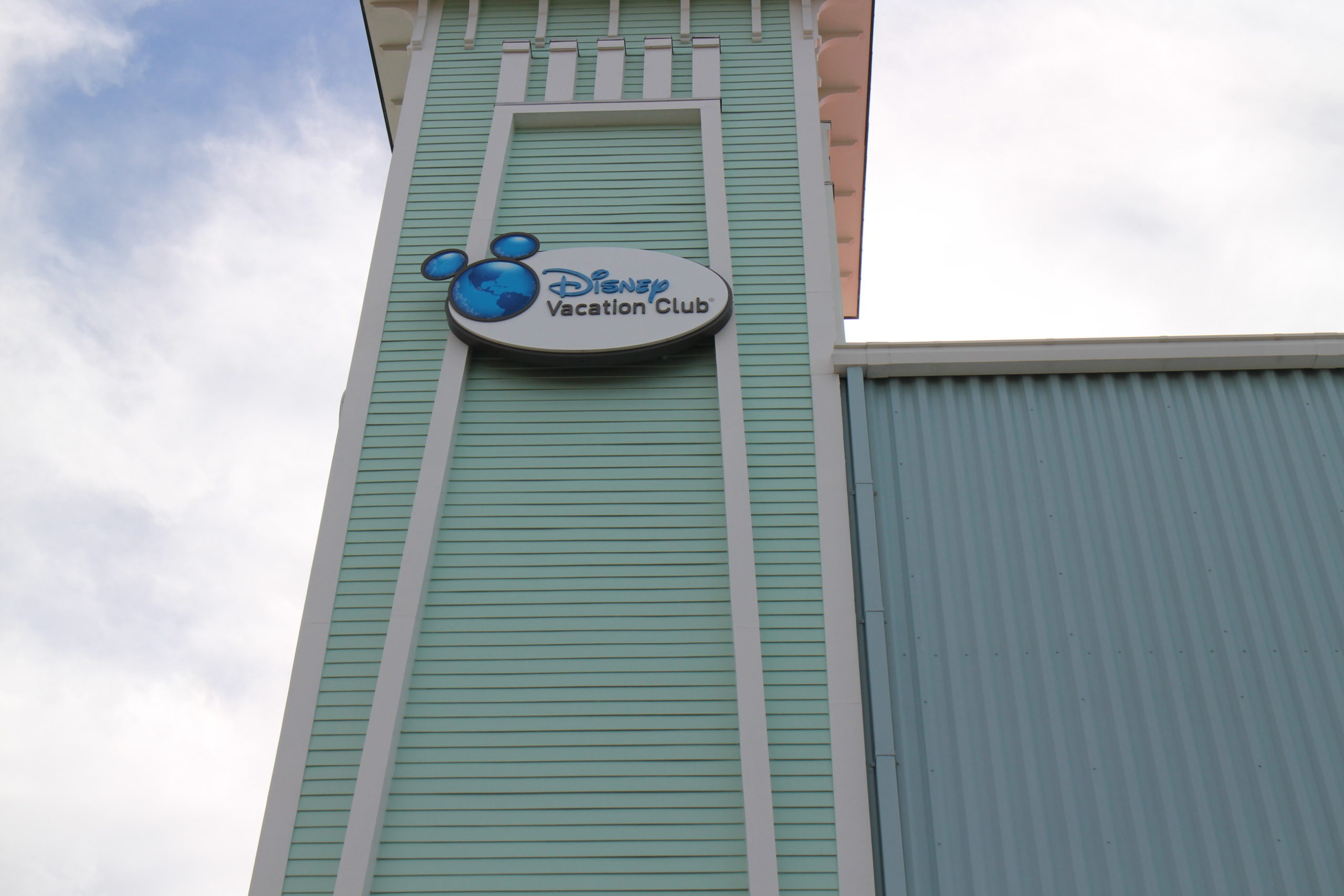 Disney Vacation Club logo on a tower at Saratoga Springs. Compare this resort to other DVC annual dues by resort.