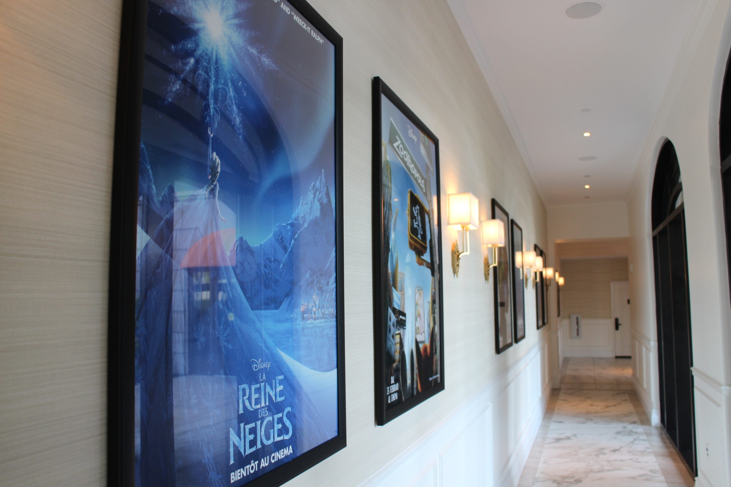 Disney Movie Posters in different languages in a hallway at Disney's Riviera Resort