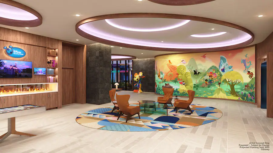 Disneyland DVC Tower Lobby with a colorful characters mural, brown chairs and a lit modern fireplace