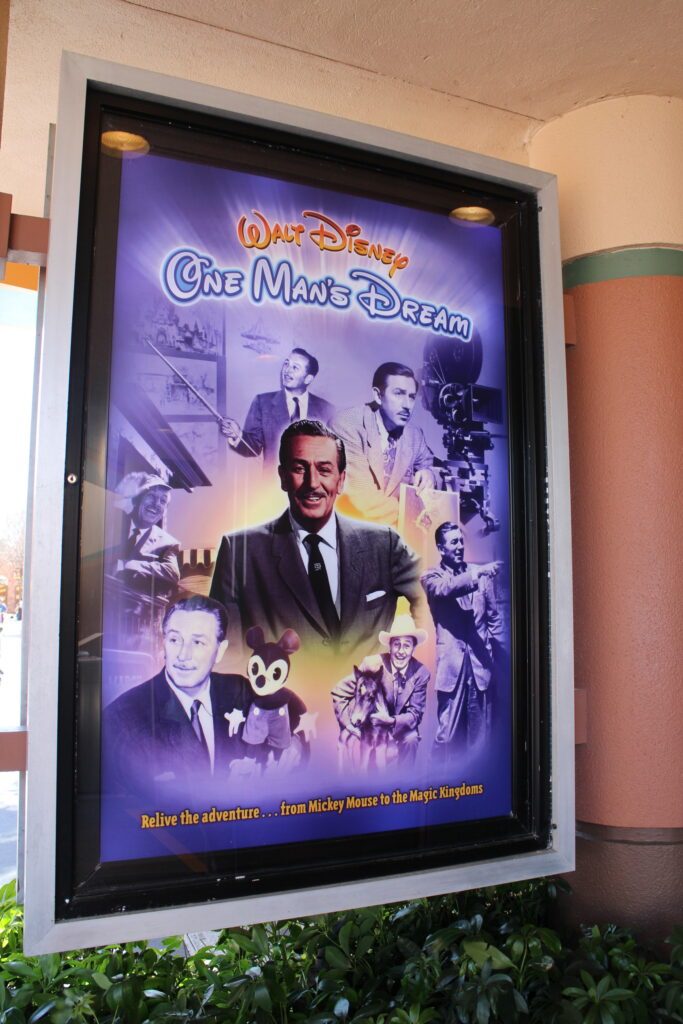 A poster featuring Walt Disney in a suit representing the show One Man's Dream at Hollywood Studios