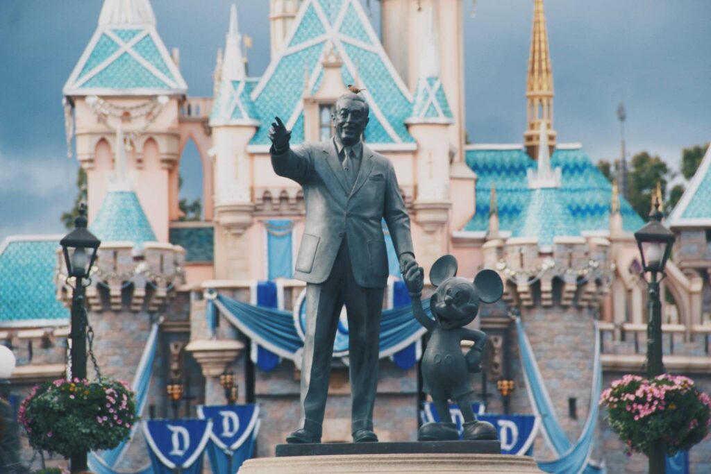 Walt Disney and Mickey Mouse Statue in front of castle