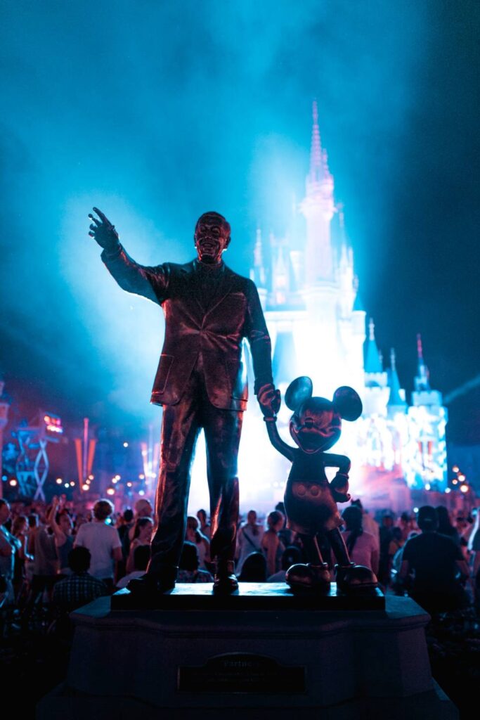 Walt and Mickey Statue under night lights