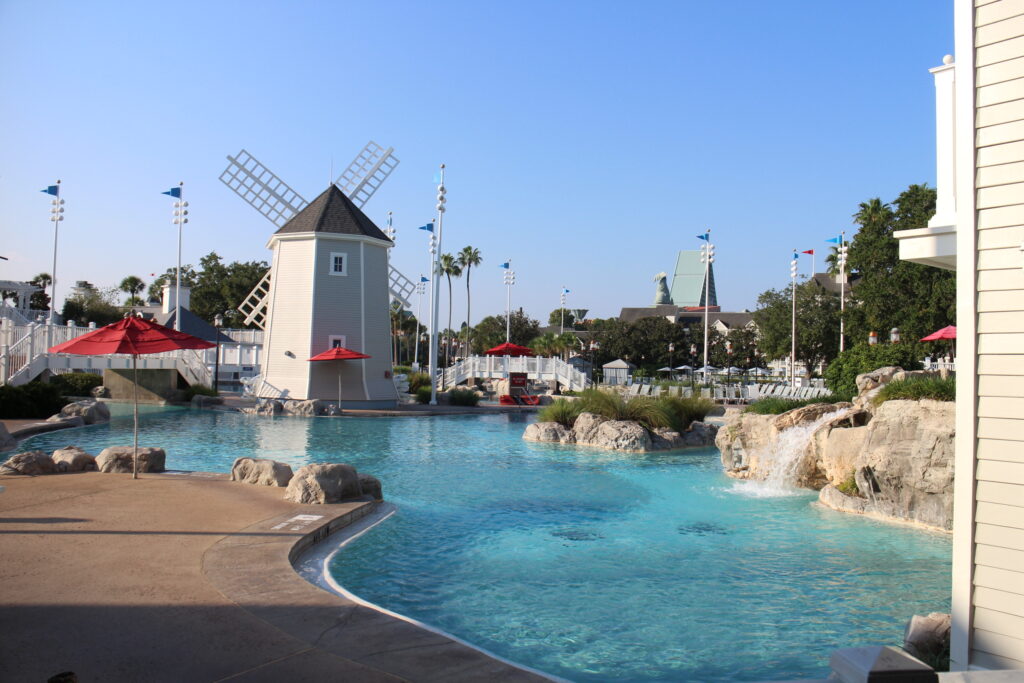 A windmill stands at the end of a wide, winding, blue pool with rocks on each side. How Long is Disney Vacation Club Membership at Beach Club? Contracts expire in 2042