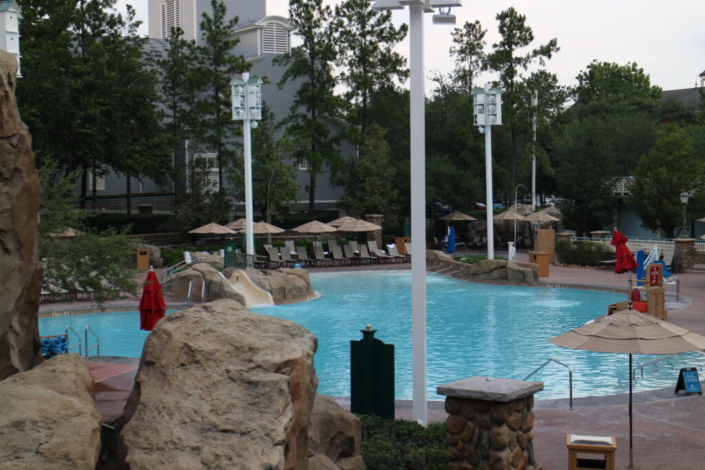 Saratoga Springs resort pool area with light blue water surrounded by seating