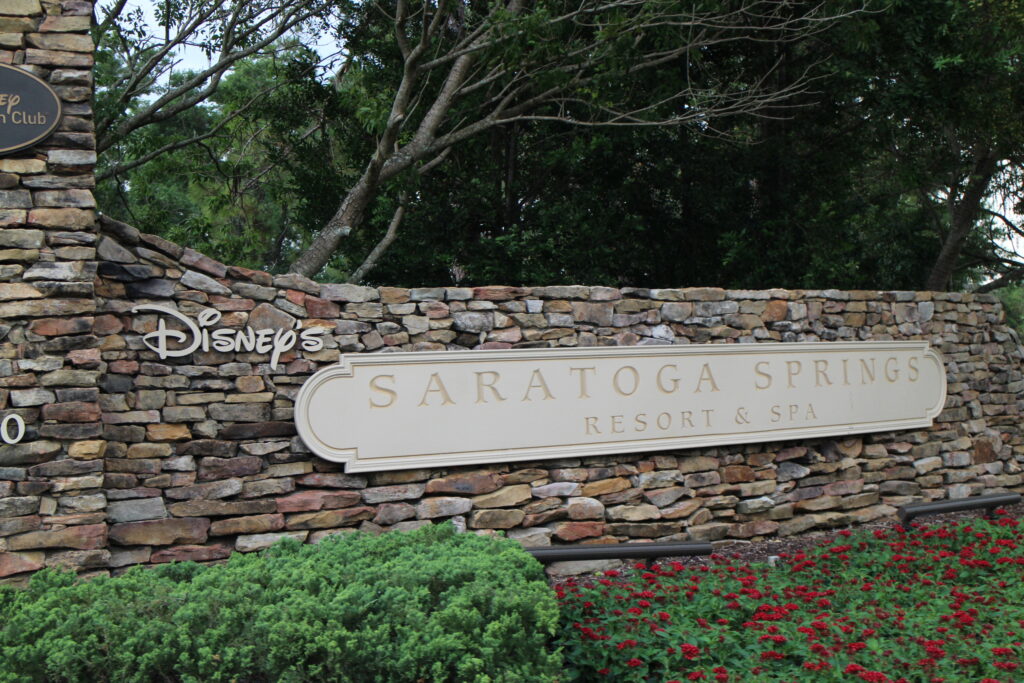 Disney's Saratoga Springs Resort and Spa entrance sign on a wall of rocks