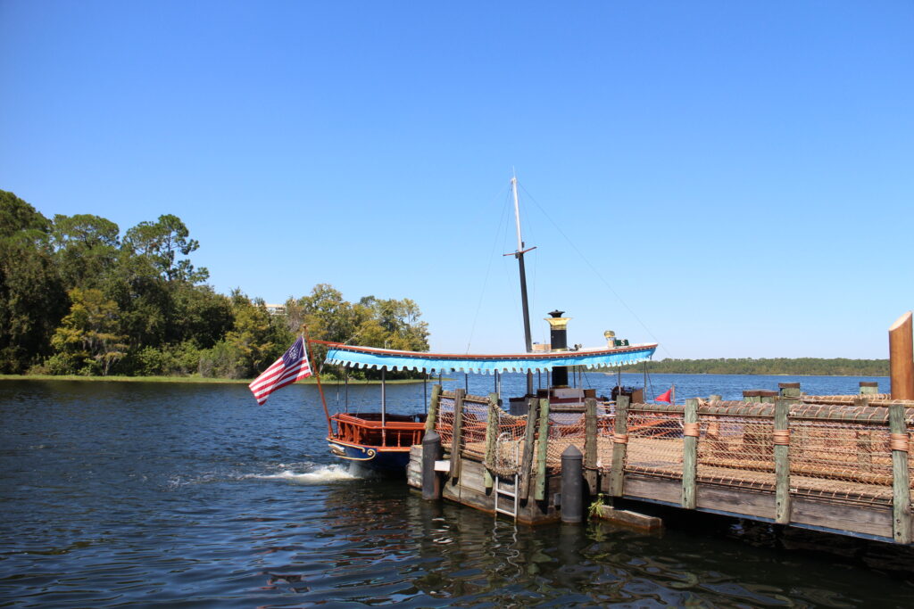A boat docked on Bay Lake at Disney's Wilderness Lodge boat dock