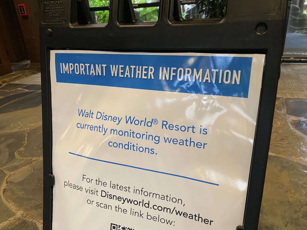A sign at the Polynesian resort that says Walt Disney World Resort is currently monitoring weather conditions