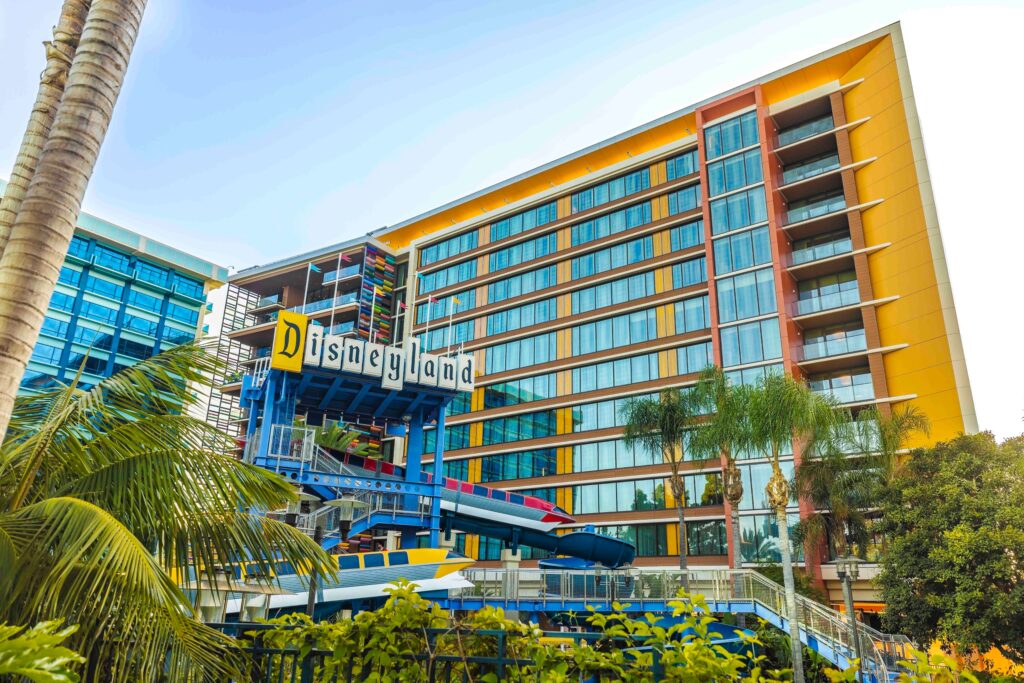 the Disneyland Hotel DVC building sits behind the monorail themed pool slides at the property