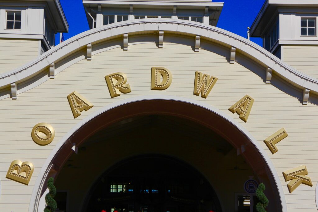 Boardwalk Resort entrance white building with Boardwalk in big gold letters over an arch