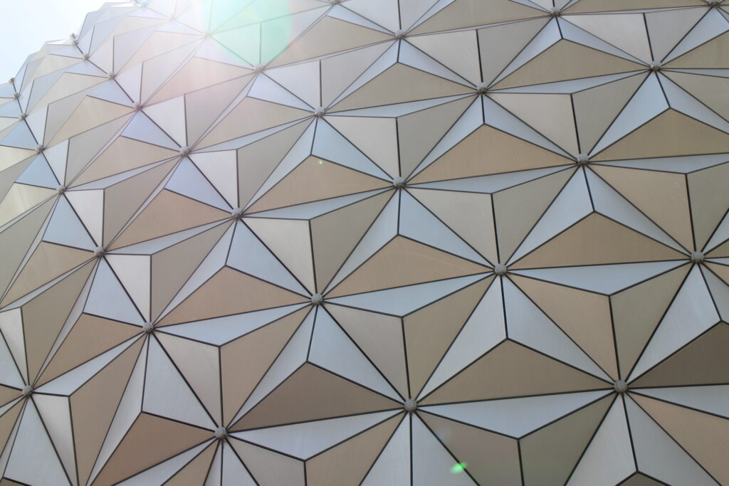 the Epcot geodesic sphere with a solar flare