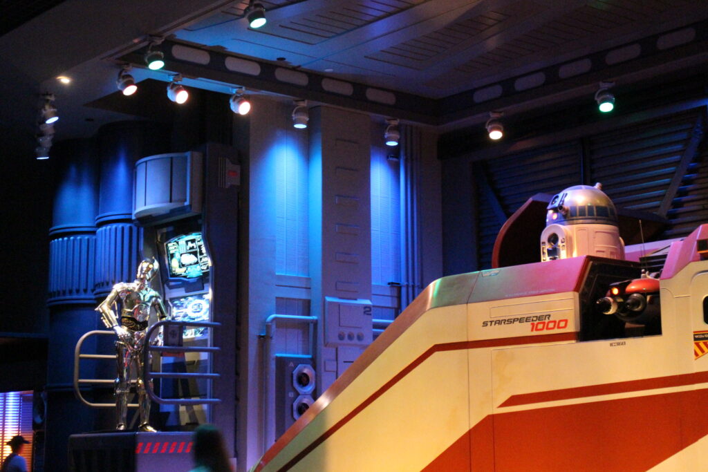 inside the queue of the Star Tours attraction C3PO and R2D2 droids talk to each other