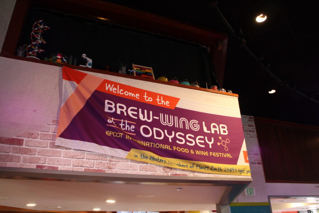 A burgundy sign for the Brew-Wing lab hangs on a wall