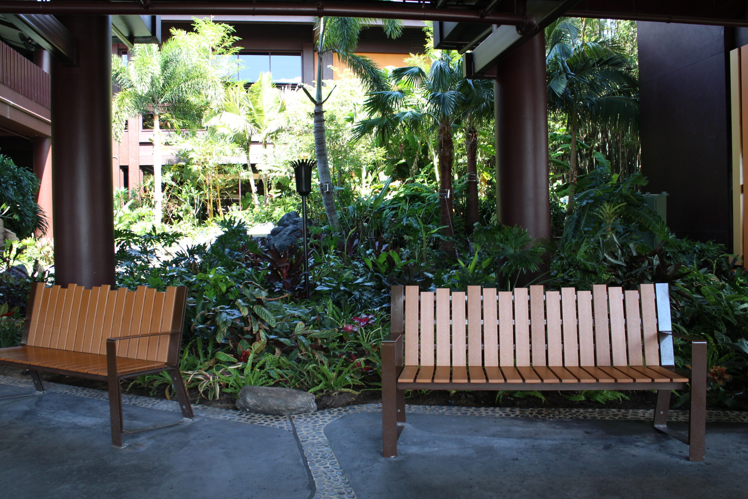 benches in front of a tropical landscape outside of the Polynesian resort