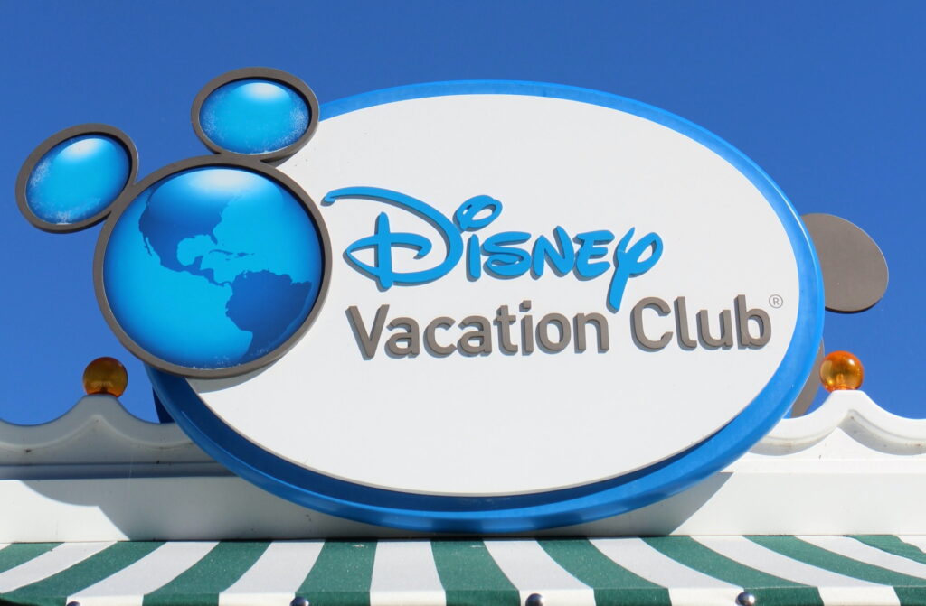 an oval Disney Vacation Club sign with the earth Mickeys ears logo, DVC taxes