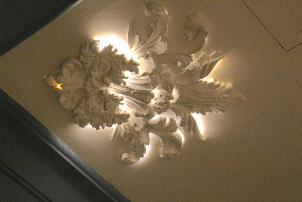 A white baroque style ceiling detail.