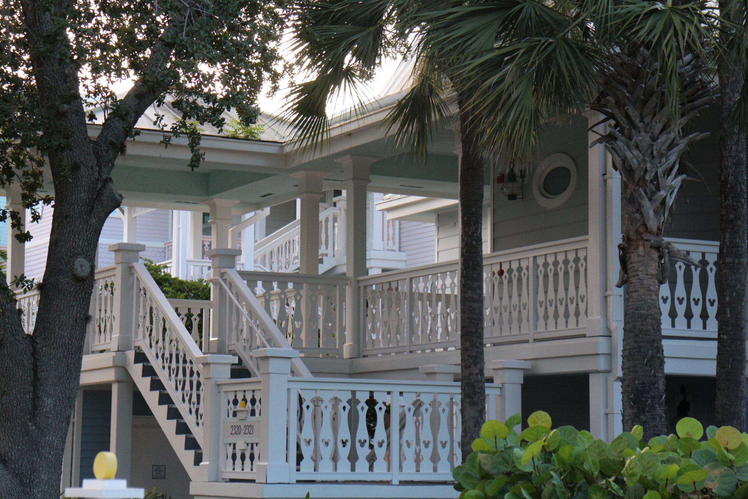 White staircases with Mickey cutouts in the railings at Old Key West resort that lead to DVC villas.