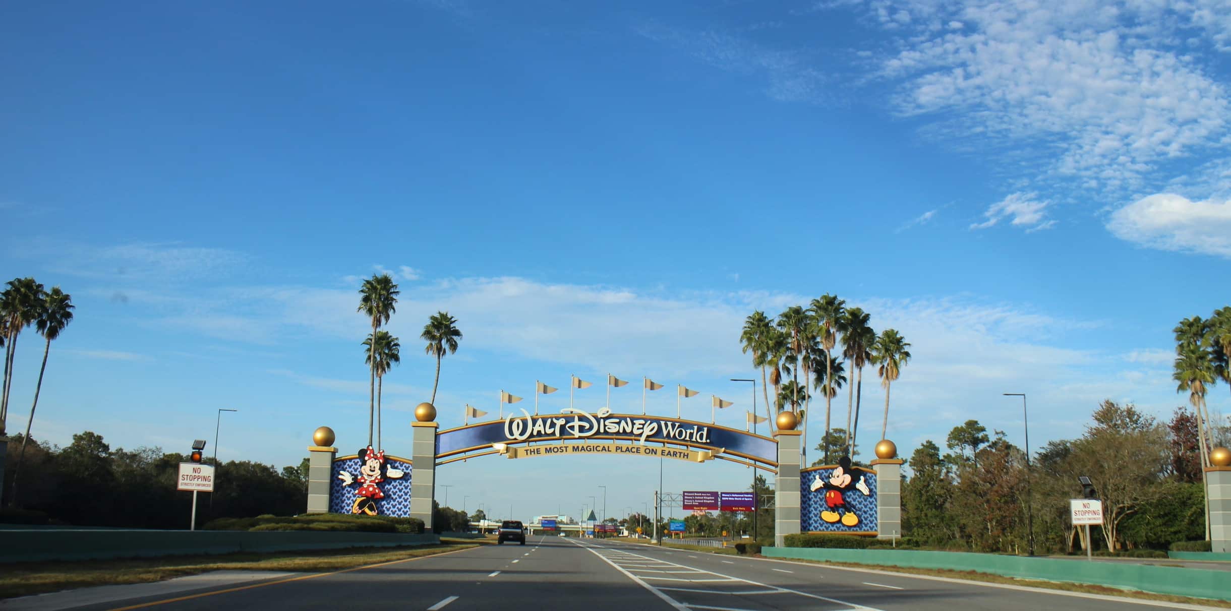 Disney World entrance gate with Mickey on the right and Minnie on the left.