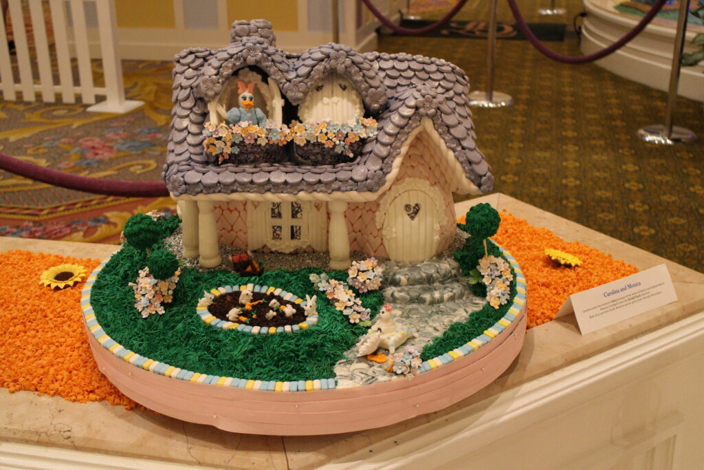 Daisy Duck house inspired Easter egg at the Grand Floridian. It has a lavender roof and a bright green lawn.