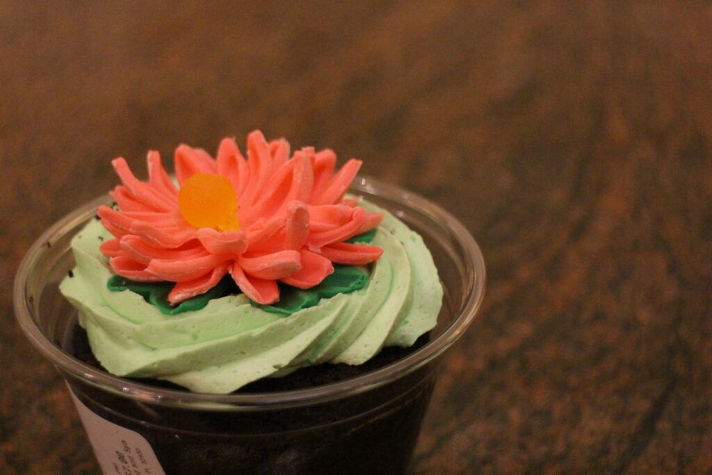 The Grand Cottage treat the Bunny Burrow Dirt Cup which has layers of chocolate cake, chocolate buttercream, and cookies ‘n cream pieces with a flower candy design on top.