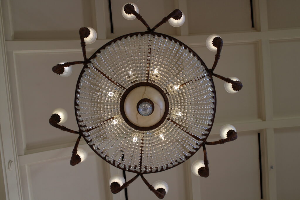 A straight up from underneath view of a beaded chandelier at Disney's BoardWalk Inn