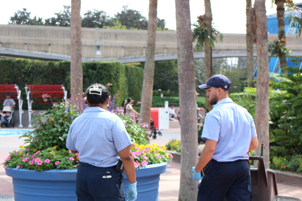 Cast Members tending to plants at Epcot.